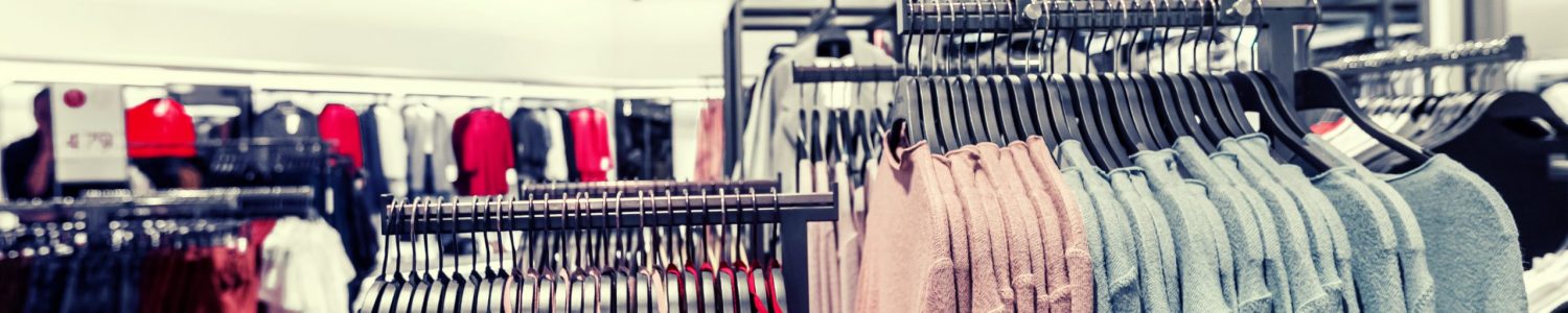 Women clothes in fashion store. Shopping mall. Women fashion shopping.